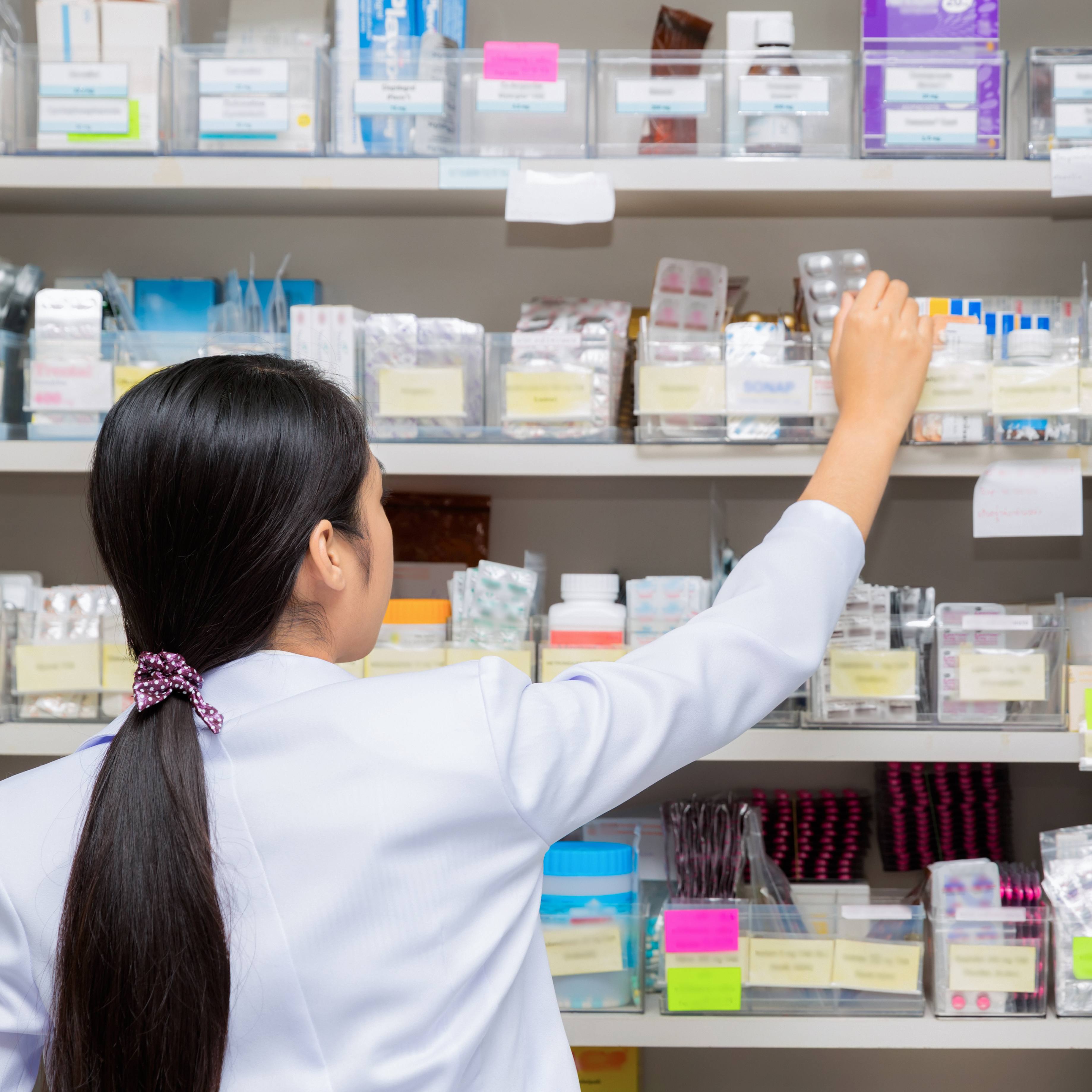 Asian woman a pharmacist in pharmacy room in hospital, drug, medicine, Tablet, capsule